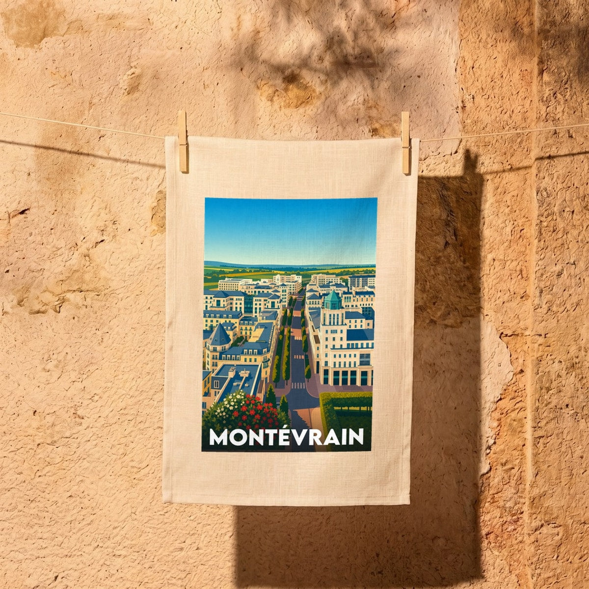 Torchon souvenir de la ville de Montévrain avec une illustration urbaine stylisée.