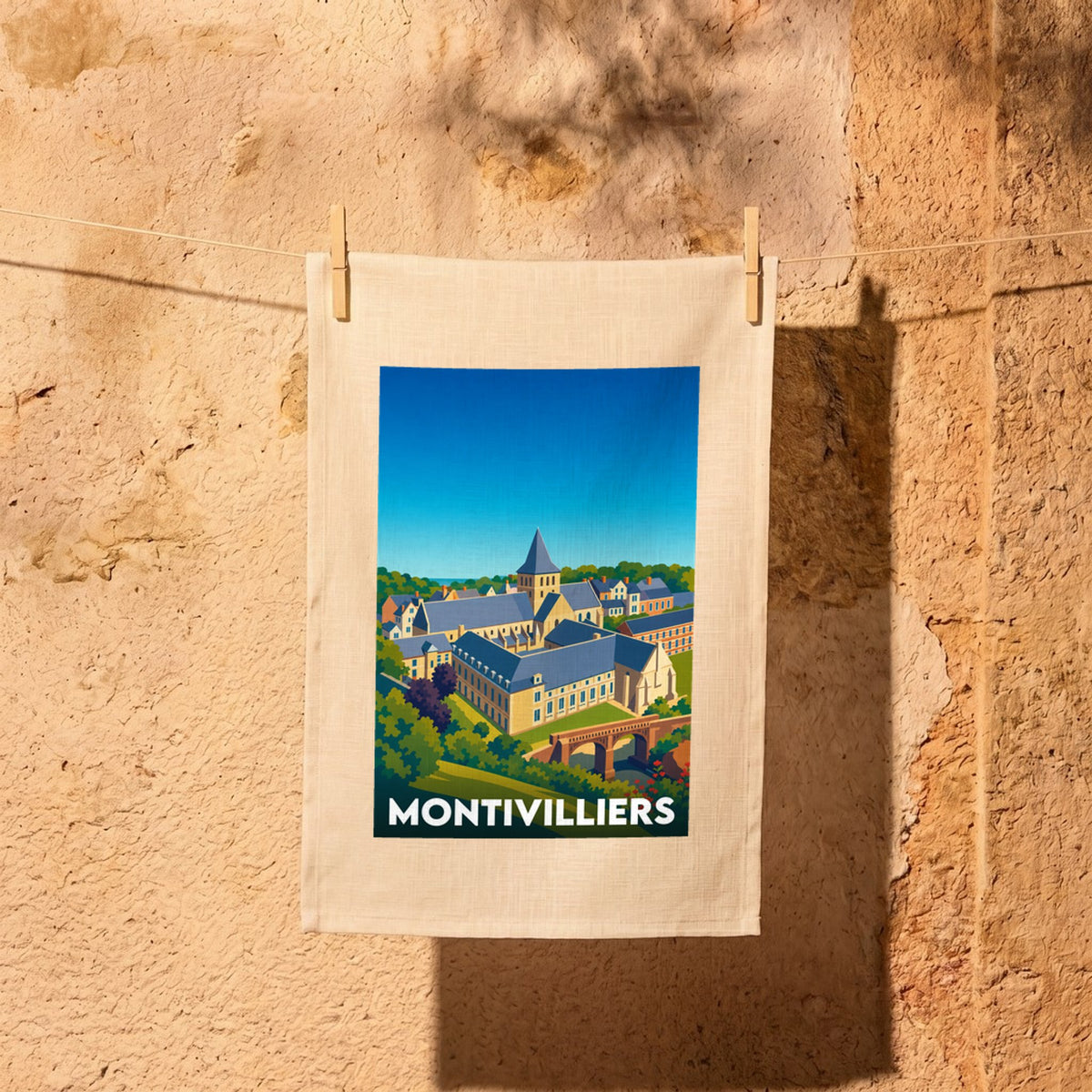 Torchon souvenir de la ville de Montivilliers avec une illustration stylisée.