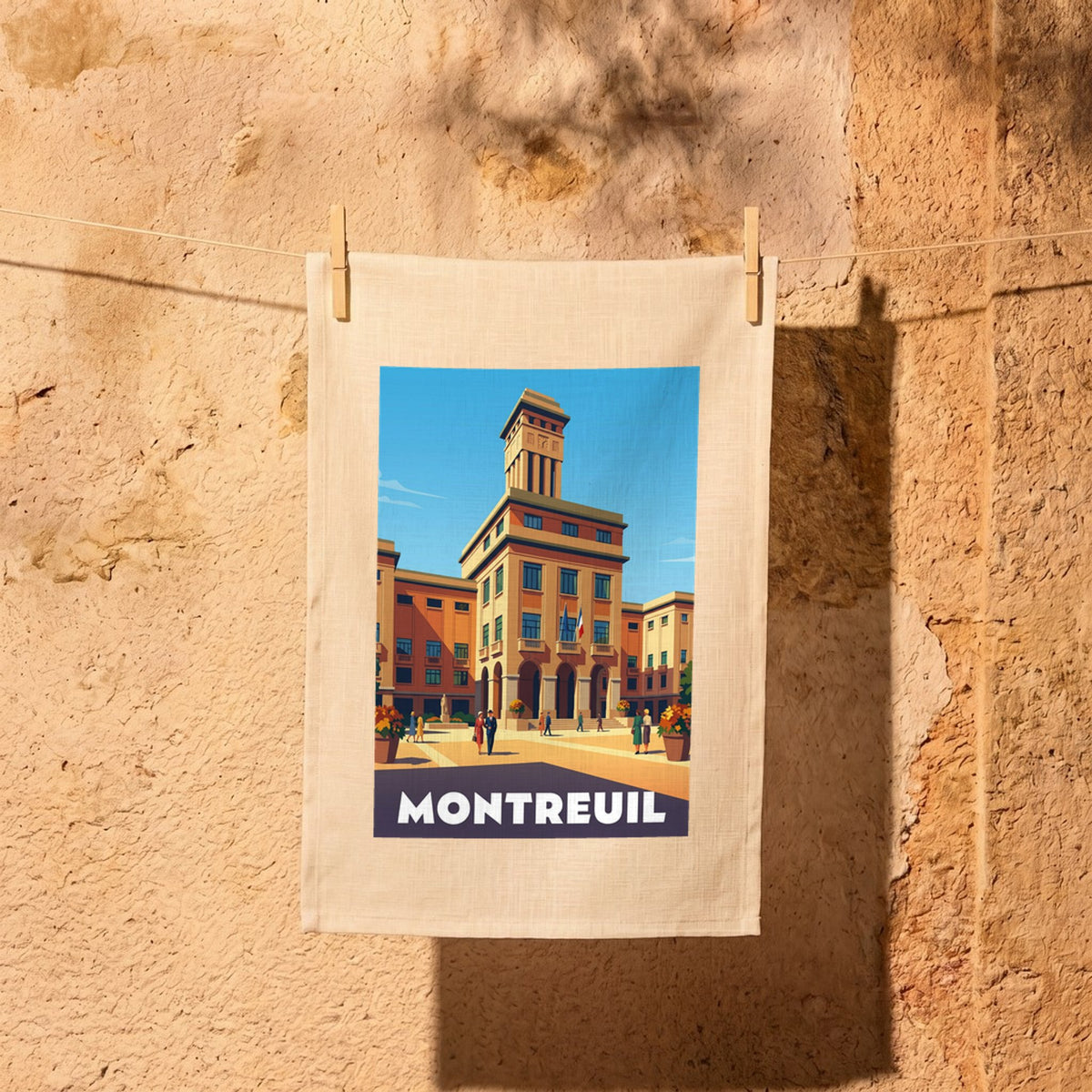 Torchon souvenir de la ville de Montreuil avec une illustration stylisée de l'hôtel de ville.