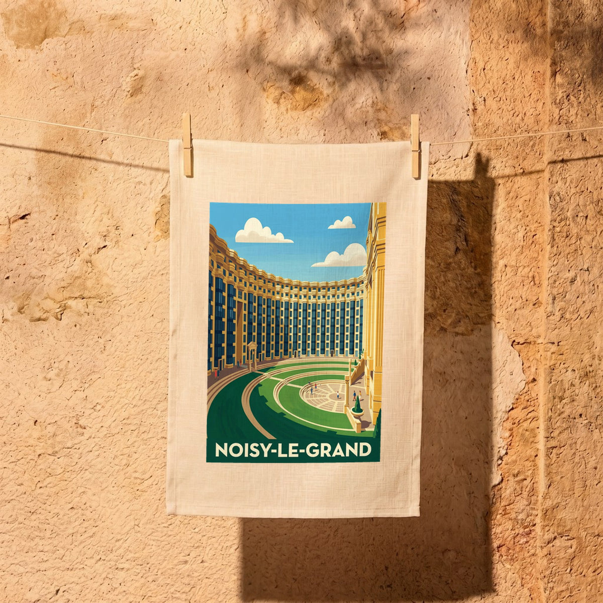 Torchon souvenir de la ville de Noisy-le-Grand avec une illustration stylisée de son architecture.
