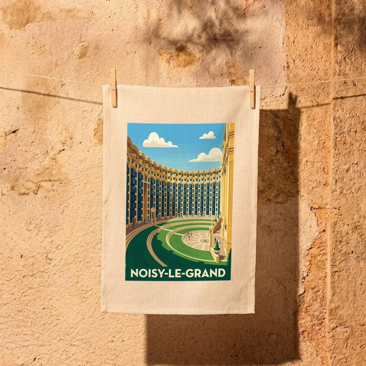 Torchon souvenir de la ville de Noisy-le-Grand avec une illustration stylisée de son architecture.