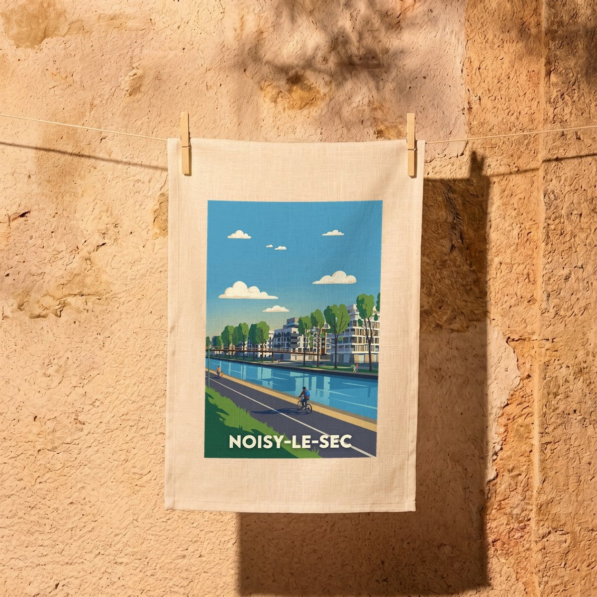Torchon souvenir de la ville de Noisy-le-Sec avec une illustration stylisée.