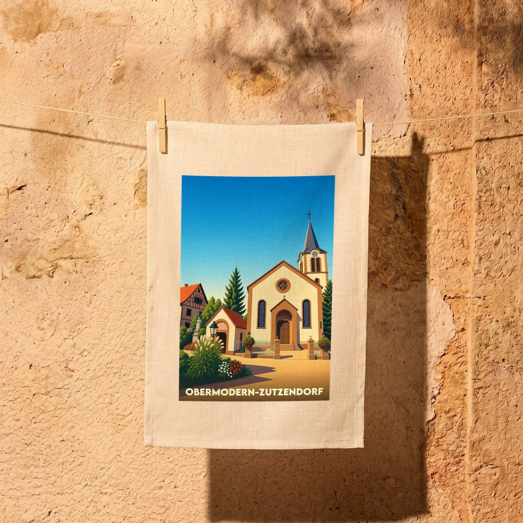 Torchon souvenir de la ville d'Obermodern-Zutzendorf avec une illustration stylisée de son église sous un ciel bleu.