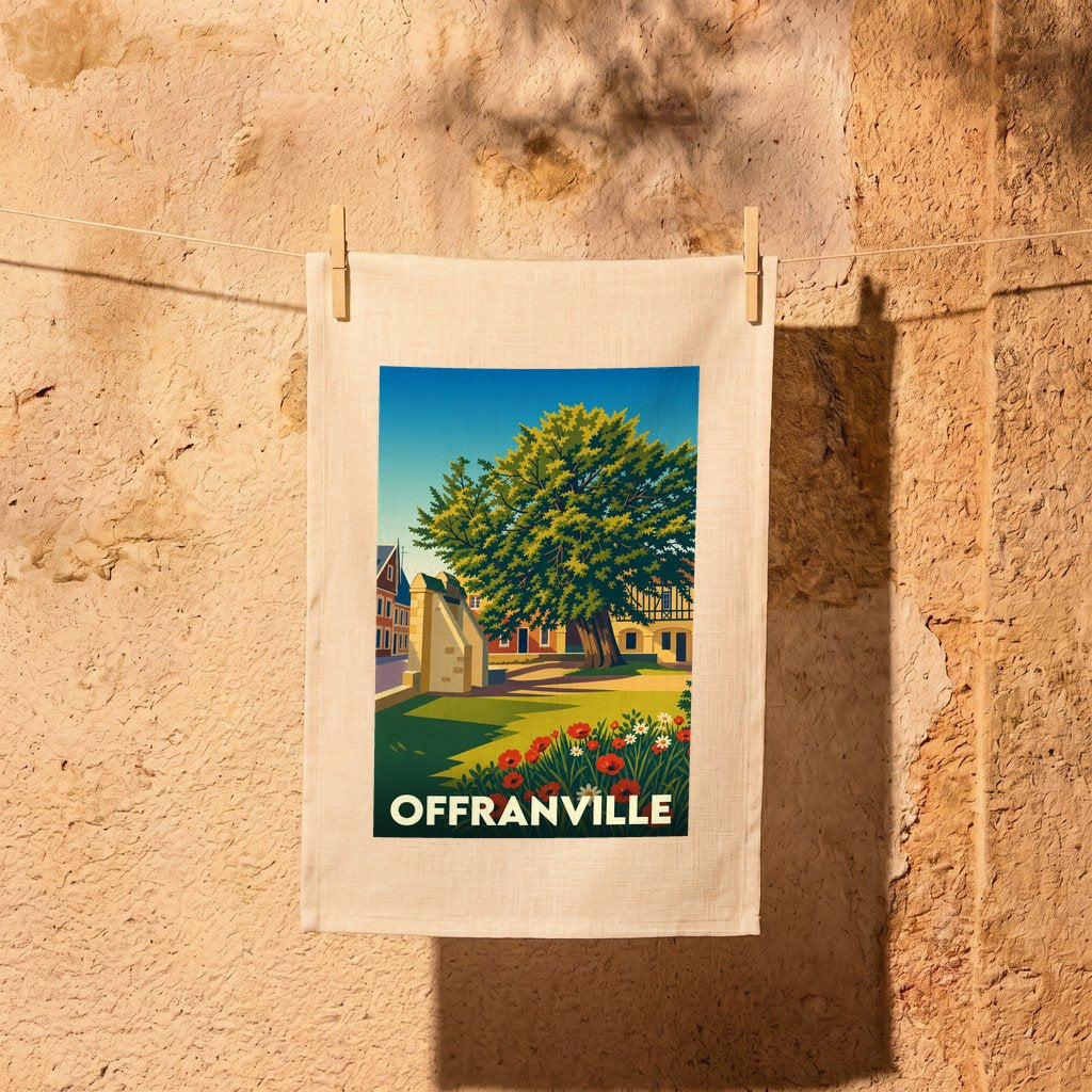 Torchon souvenir de la ville d'Offranville avec une illustration stylisée d'un grand arbre et de maisons fleuries.
