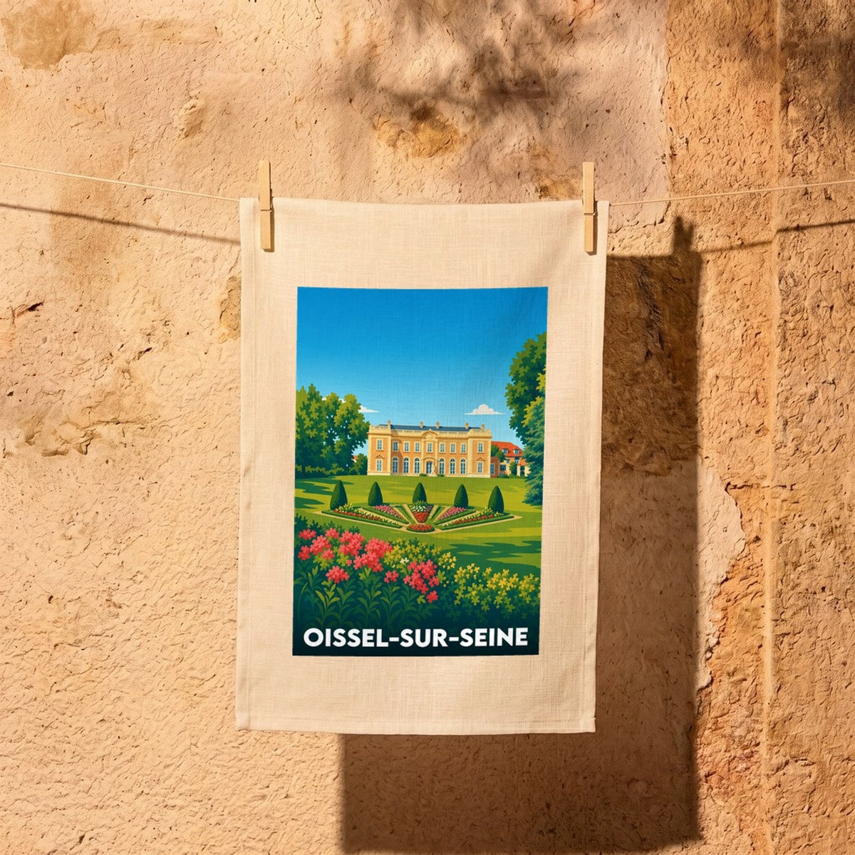 Torchon souvenir de la ville d'Oissel-sur-Seine avec une illustration stylisée d'un château et de ses jardins.