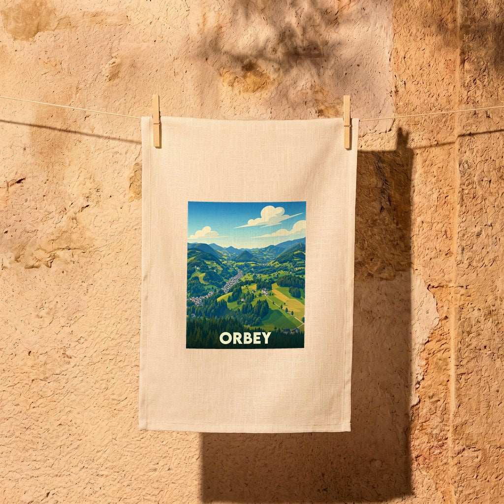 Torchon souvenir de la ville d'Orbey avec une illustration stylisée de ses paysages montagneux.