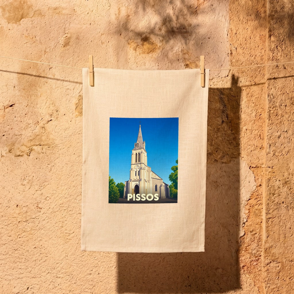 Torchon souvenir de la ville de Pissos avec une illustration stylisée de son église sous un ciel bleu.