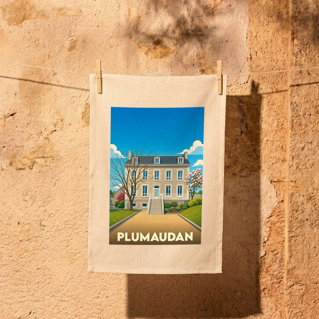 Torchon souvenir de la ville de Plumaudan avec une illustration stylisée d'une maison de maître.
