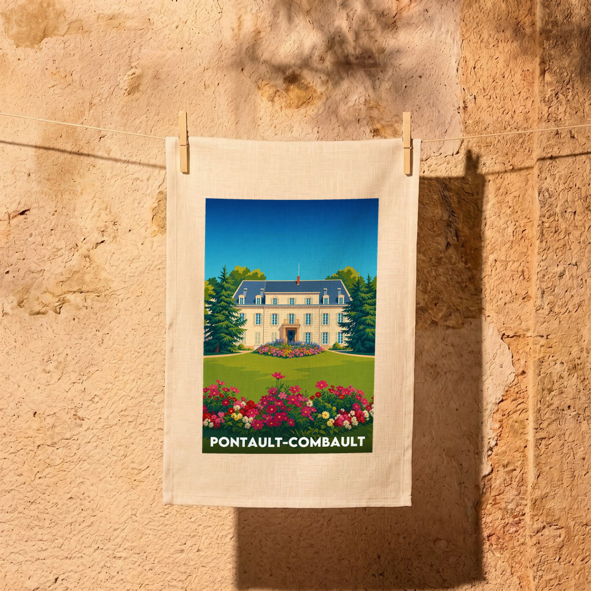 Torchon souvenir de la ville de Pontault-Combault avec une illustration stylisée d'un manoir et de jardins fleuris.