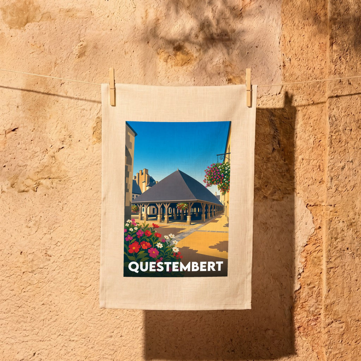 Torchon souvenir de la ville de Questembert illustrant ses halles historiques dans un style graphique épuré.