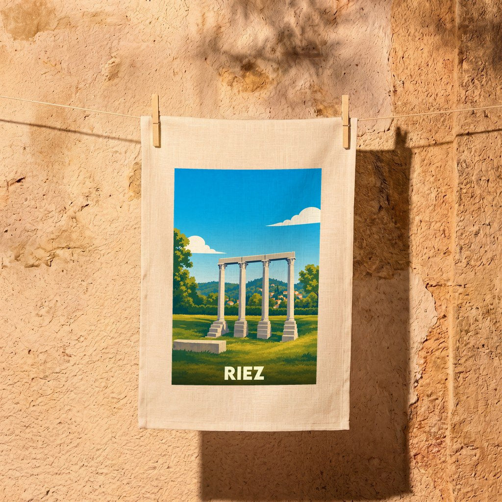 Torchon souvenir de la ville de Riez avec une illustration stylisée de colonnes antiques.