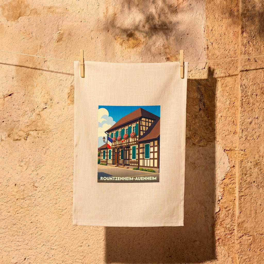 Torchon souvenir de la ville de Rountzenheim-Auenheim avec une illustration stylisée d'une maison à colombages.