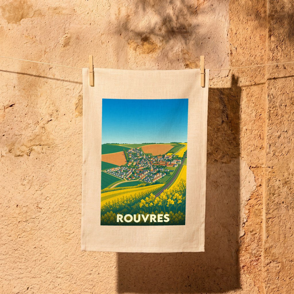 Torchon souvenir de la ville de Rouvres avec une illustration stylisée d'un paysage de campagne.