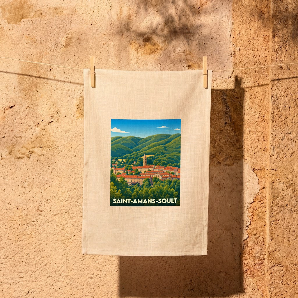 Torchon souvenir de la ville de Saint-Amans-Soult avec une illustration paysagère stylisée.