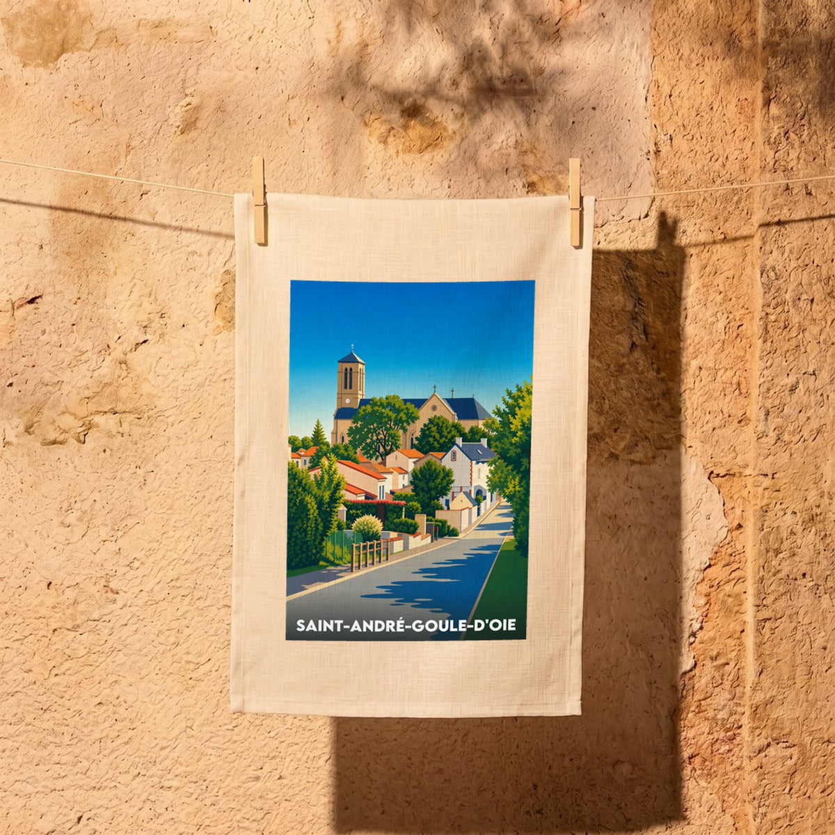 Torchon souvenir de la ville de Saint-André-Goule-d'Oie avec une illustration colorée et stylisée.