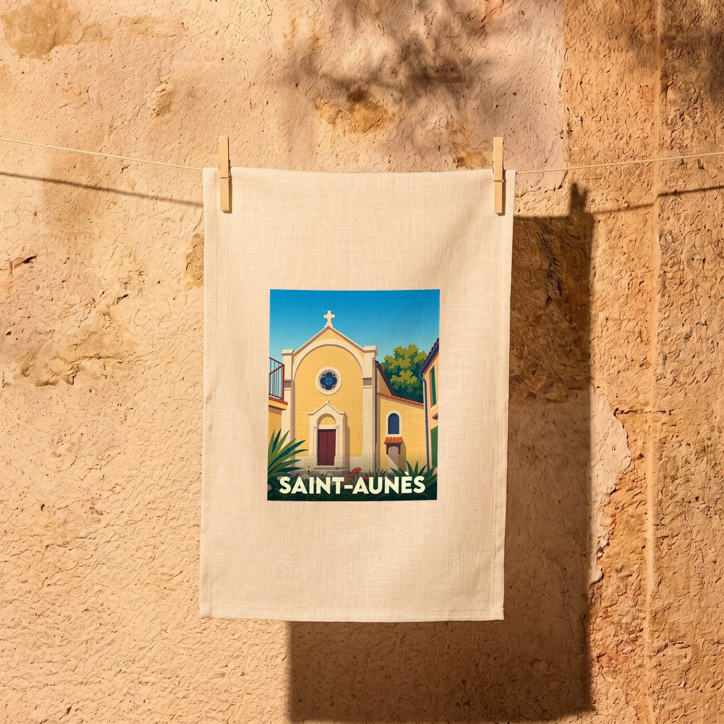 Torchon souvenir de la ville de Saint-Aunès avec une illustration stylisée de son église.