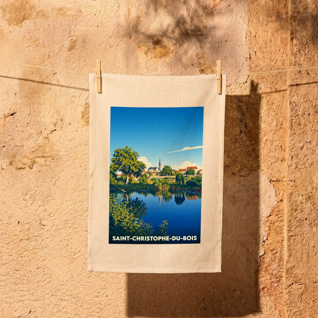 Torchon souvenir de la ville de Saint-Christophe-du-Bois avec une illustration stylisée d'un paysage au bord de l'eau.