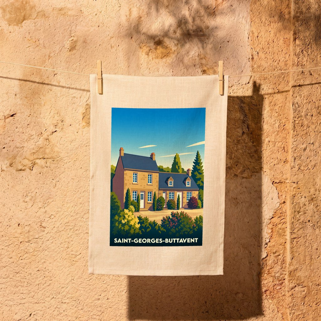 Torchon souvenir de la ville de Saint-Georges-Buttavent avec une illustration stylisée d'une maison traditionnelle.