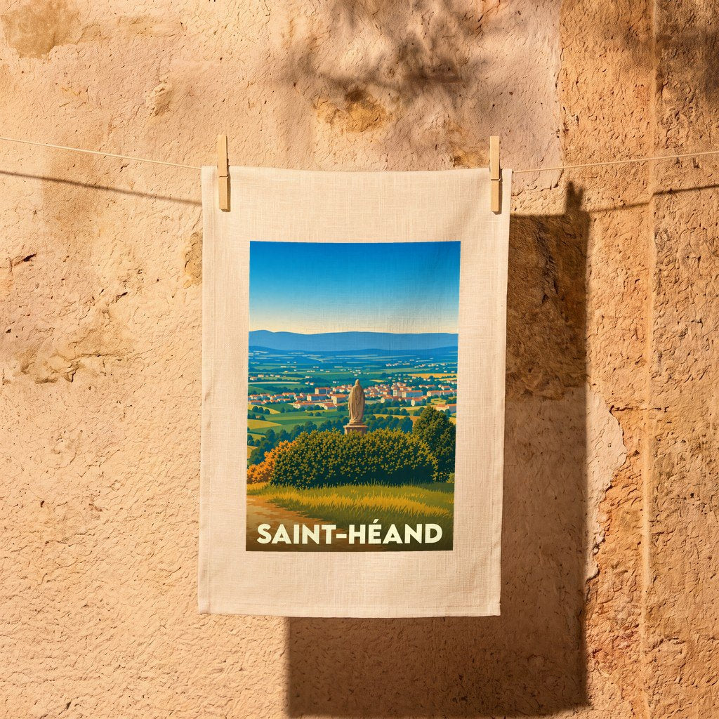 Torchon souvenir de la ville de Saint-Héand illustrant un paysage vallonné surplombé d'une statue.