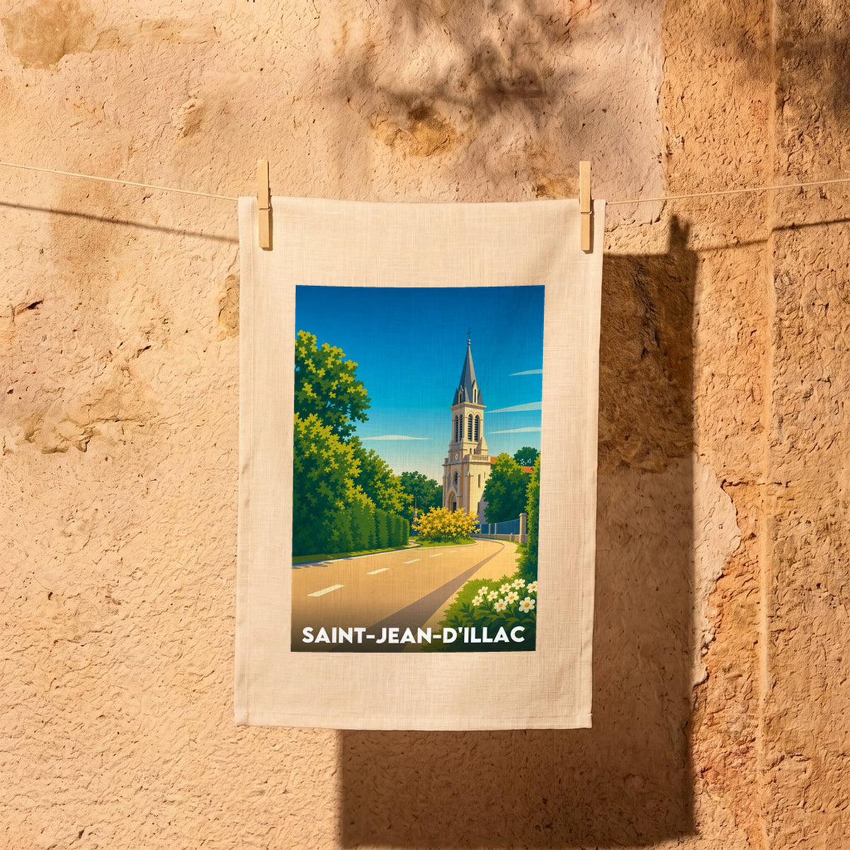 Torchon souvenir de la ville de Saint-Jean-d'Illac avec une illustration stylisée de son église.