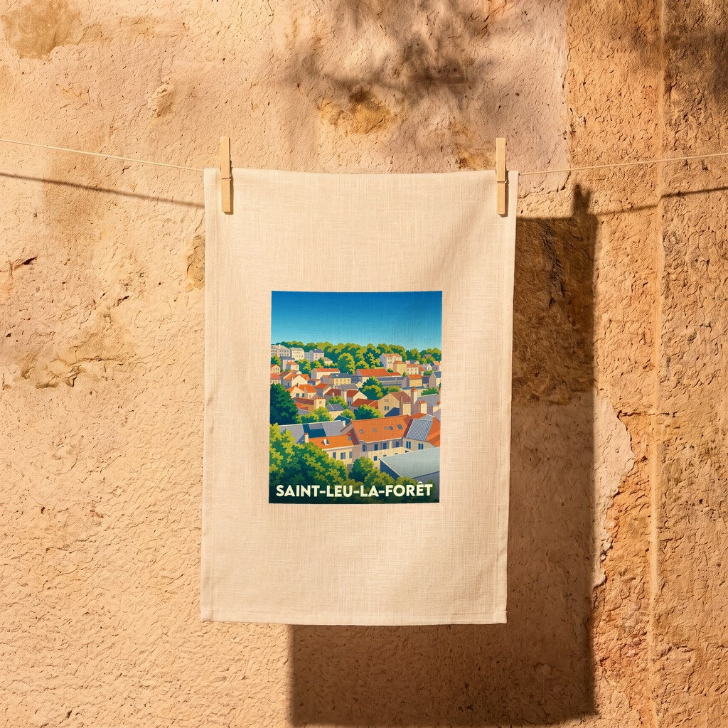 Torchon souvenir de la ville de Saint-Leu-la-Forêt avec une illustration stylisée de ses toits et de sa forêt.