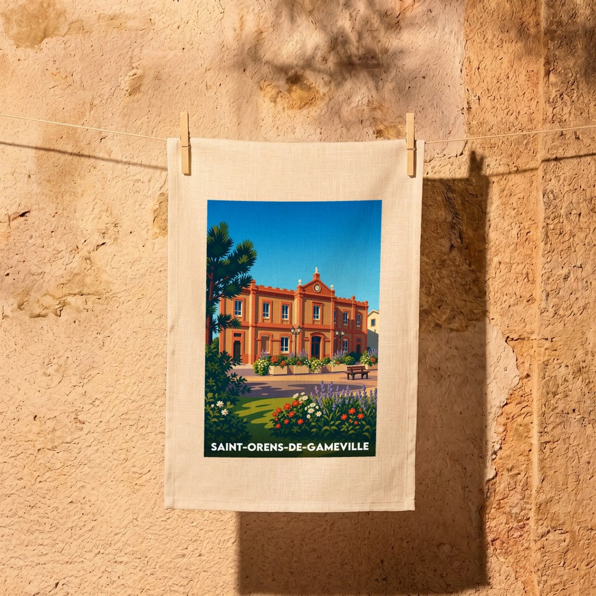 Torchon souvenir de la ville de Saint-Orens-de-Gameville avec une illustration stylisée.