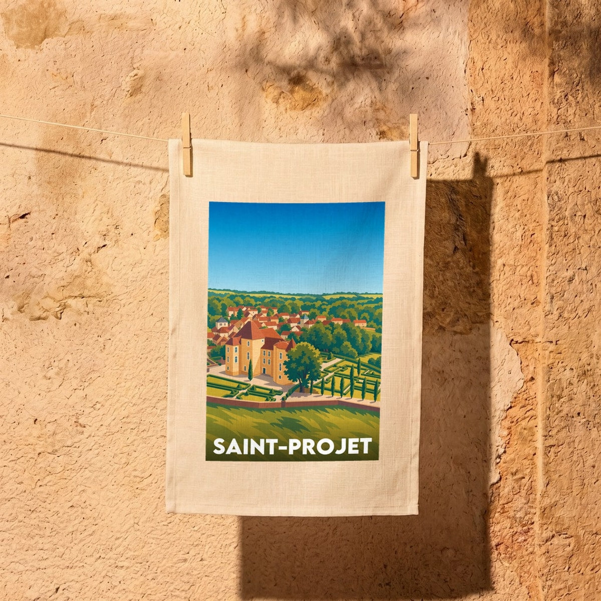 Torchon souvenir de la ville de Saint-Projet avec une illustration stylisée de son château.