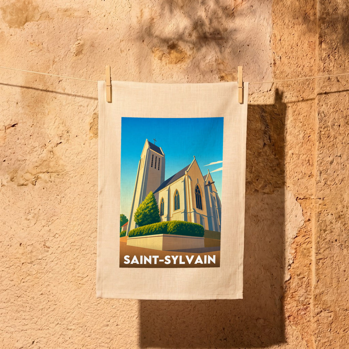 Torchon souvenir de la ville de Saint-Sylvain avec une illustration stylisée de son église.