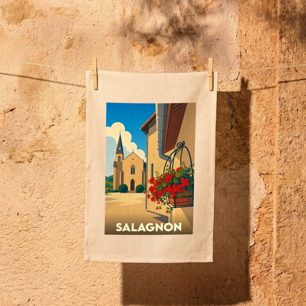 Torchon souvenir de la ville de Salagnon avec une illustration stylisée d'une église et de fleurs.