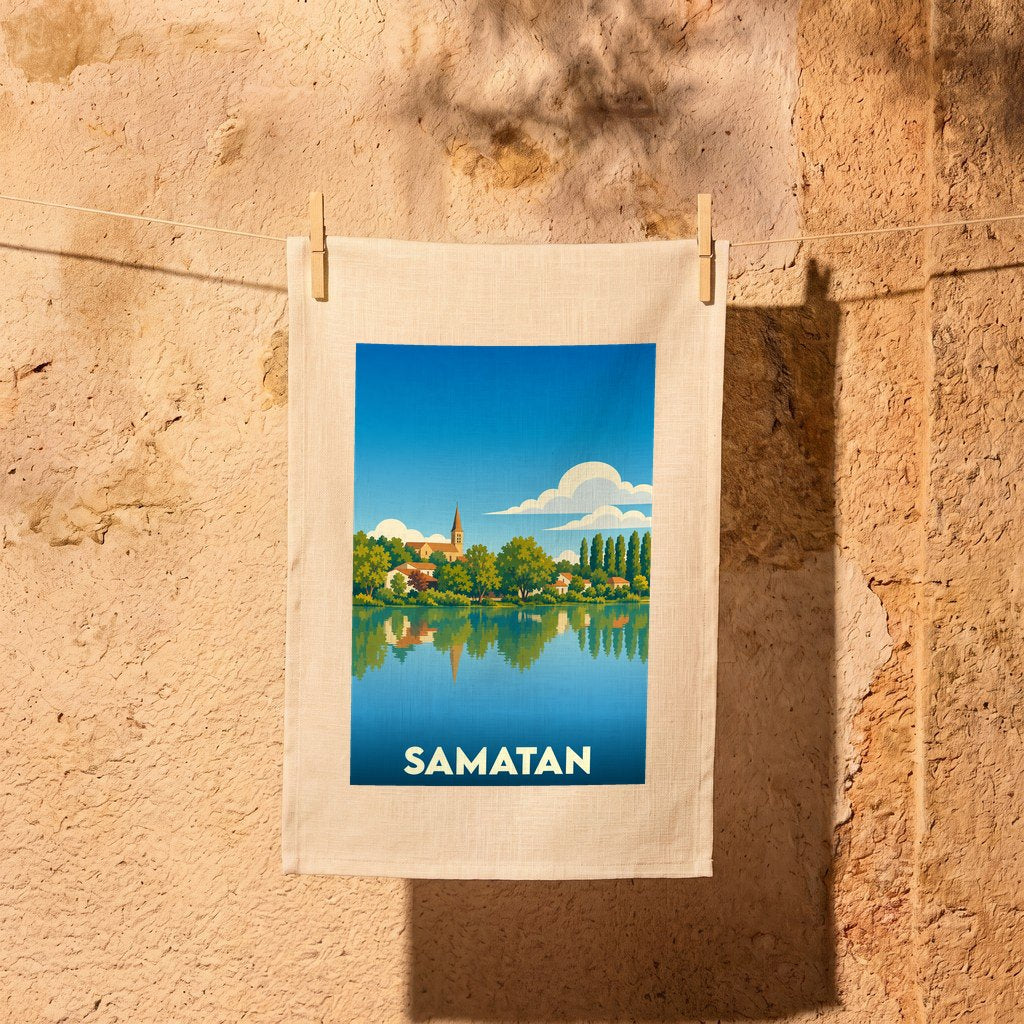 Torchon souvenir de la ville de Samatan avec une illustration stylisée d'un paysage lacustre.
