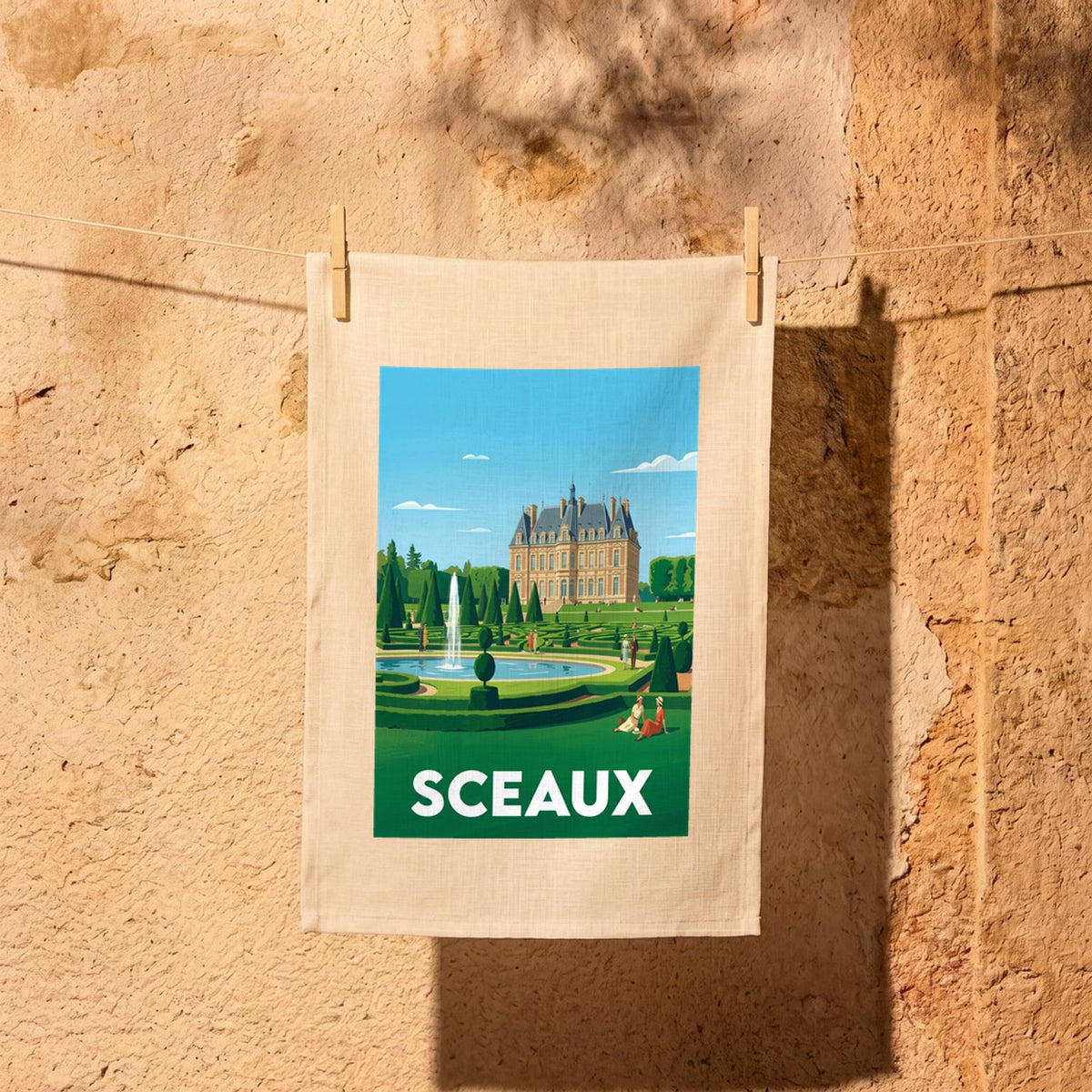Torchon souvenir de la ville de Sceaux avec une illustration stylisée de son château et de ses jardins.
