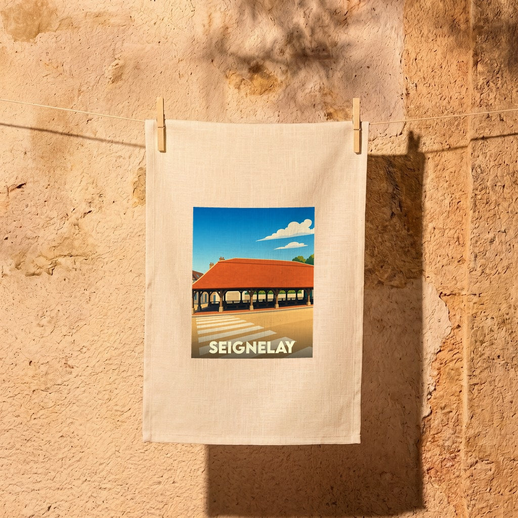 Torchon souvenir de la ville de Seignelay avec une illustration stylisée de ses halles historiques.
