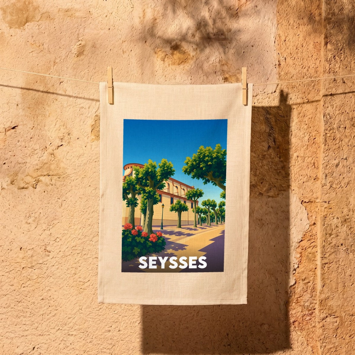 Torchon souvenir de la ville de Seysses avec une illustration stylisée.
