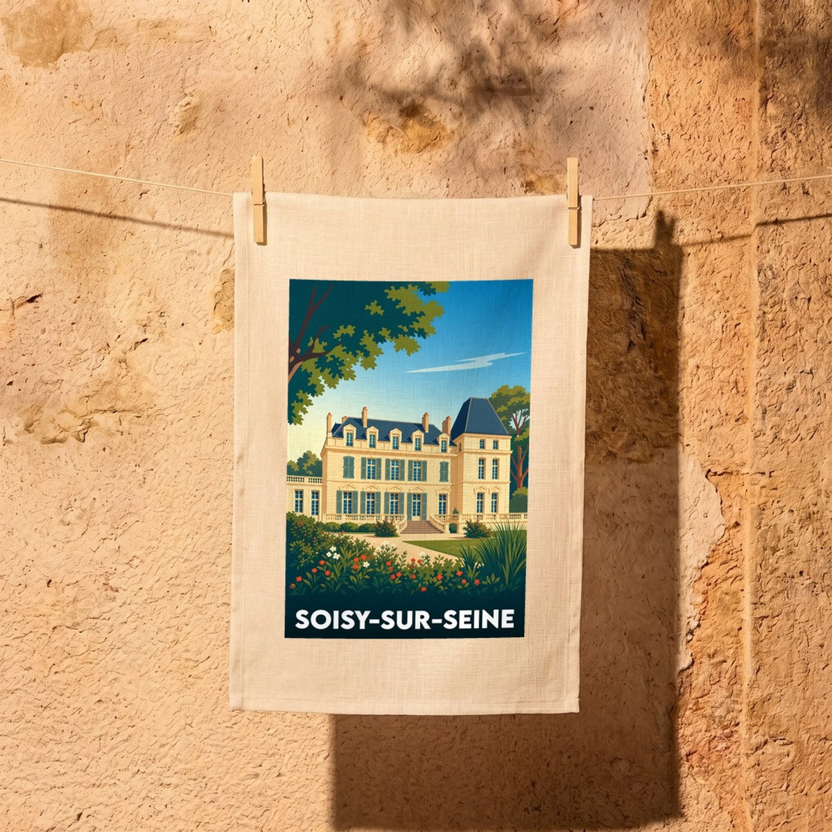 Torchon souvenir de la ville de Soisy-sur-Seine illustrant une grande demeure bourgeoise dans un style affiche rétro.