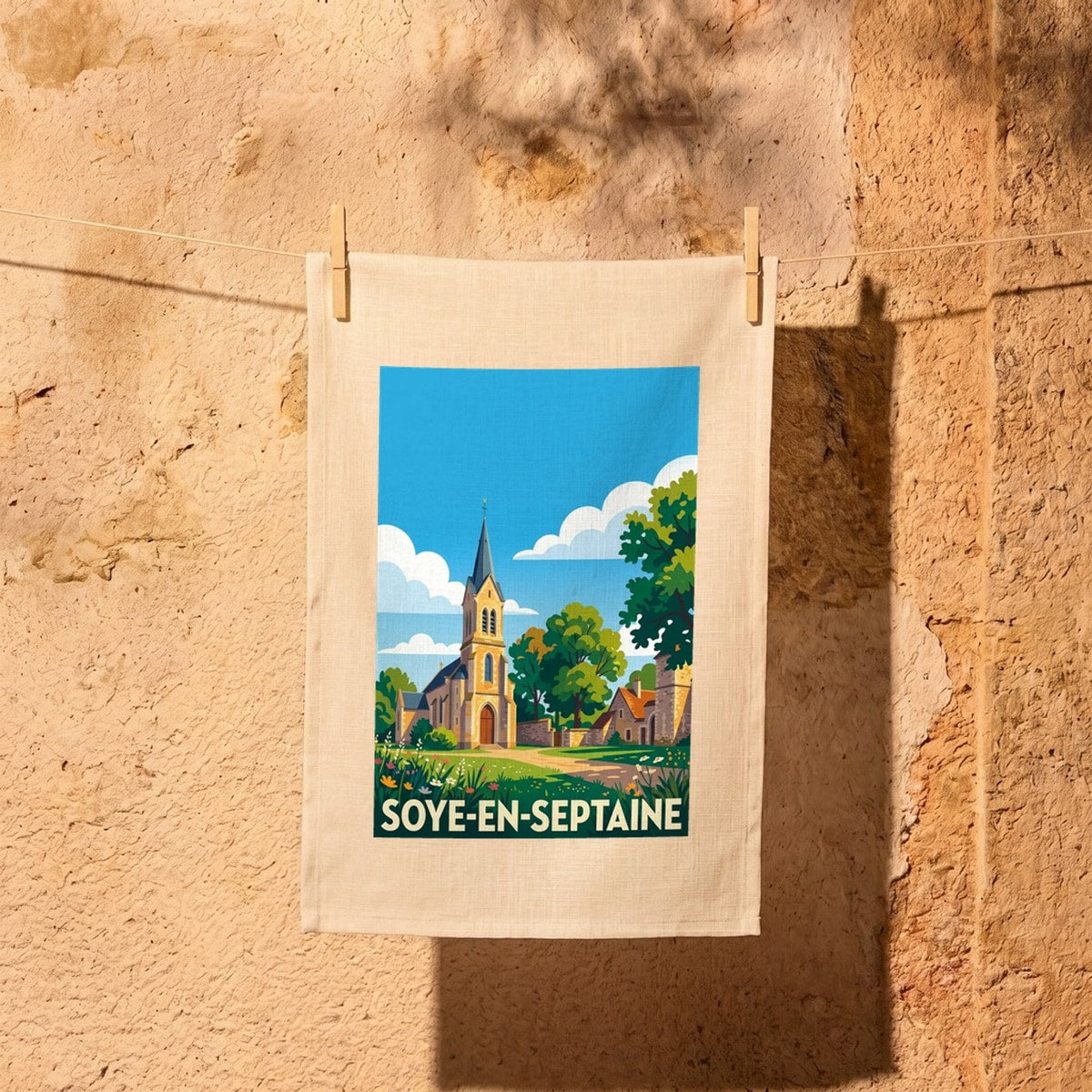 Torchon souvenir de la ville de Soye-en-Septaine avec une illustration stylisée.