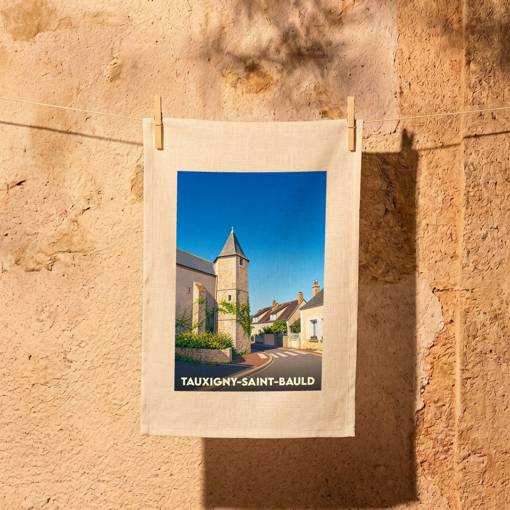 Torchon souvenir de la ville de Tauxigny-Saint-Bauld avec une illustration stylisée.