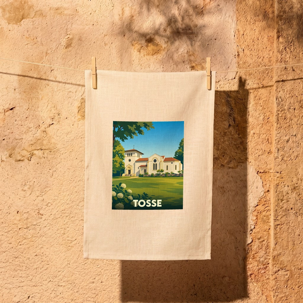 Torchon souvenir de la ville de Tosse avec une illustration stylisée de son église.