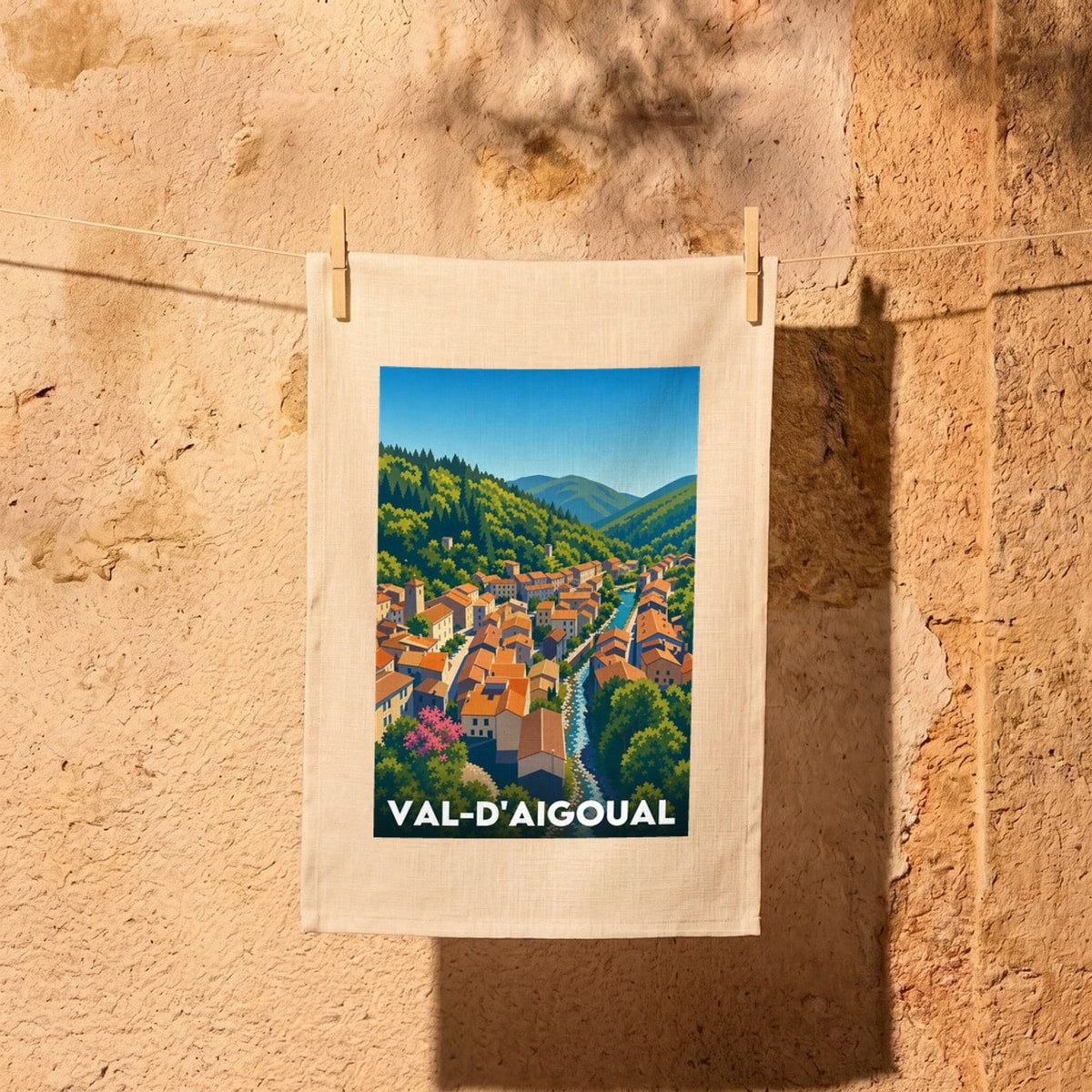 Torchon souvenir de la ville de Val-d'Aigoual avec une illustration stylisée de sa vallée.