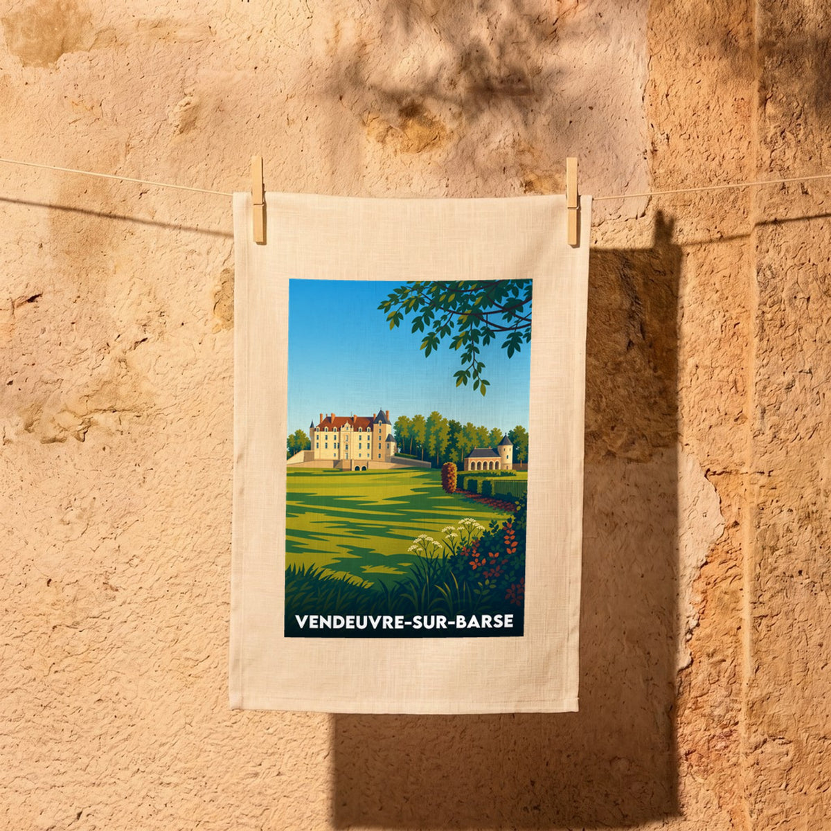 Torchon souvenir de la ville de Vendeuvre-sur-Barse avec une illustration stylisée de son château.