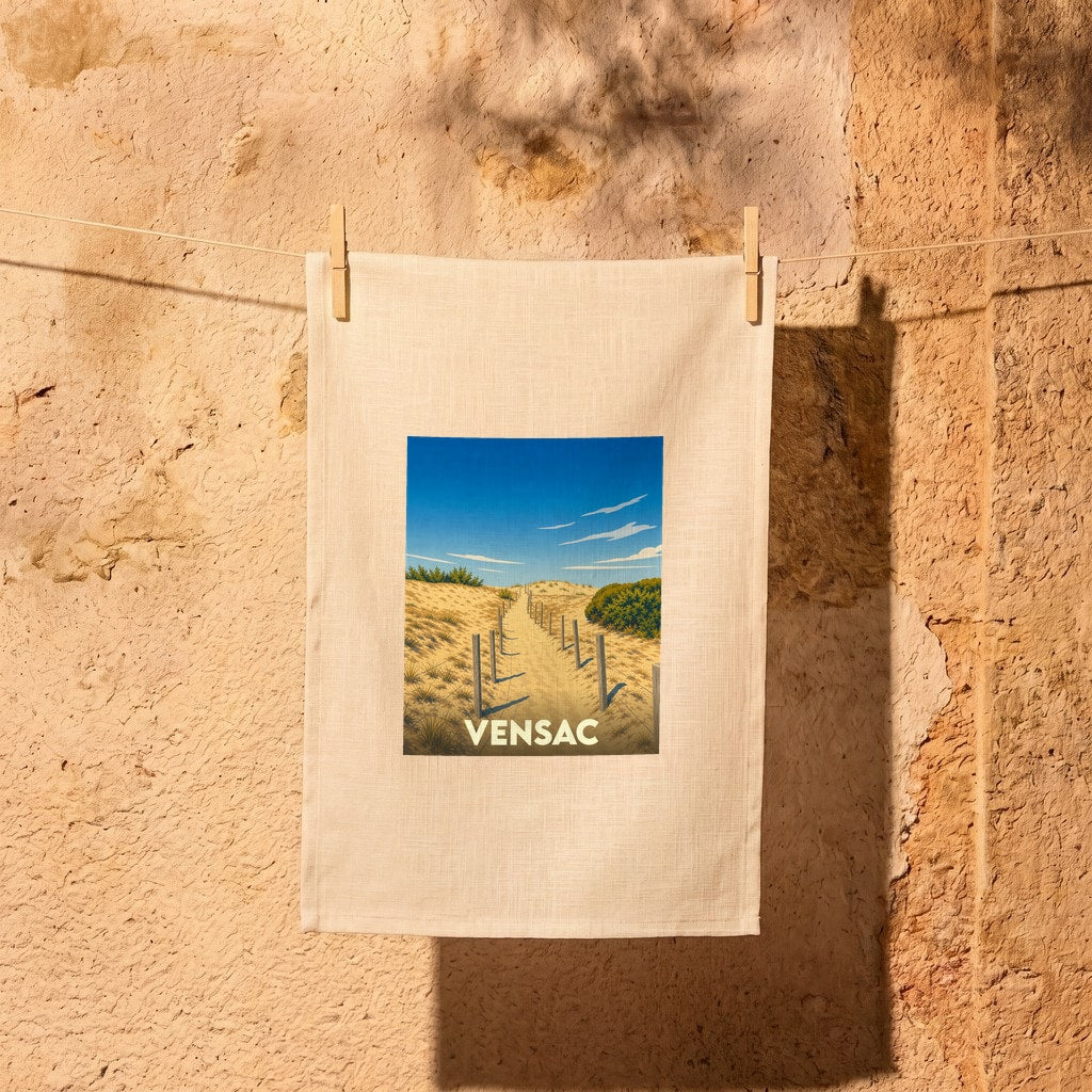 Torchon souvenir de la ville de Vensac avec une illustration stylisée d'un chemin à travers les dunes.