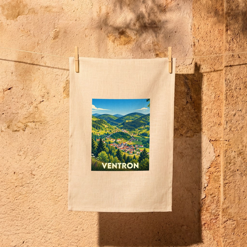 Torchon souvenir de la ville de Ventron avec une illustration stylisée de paysages montagneux.