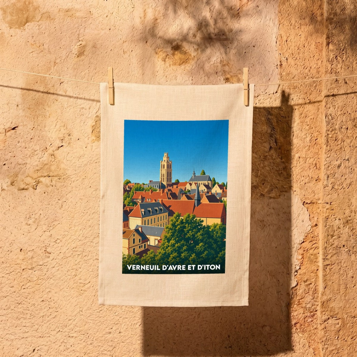 Torchon souvenir de la ville de Verneuil d'Avre et d'Iton avec une illustration panoramique stylisée.