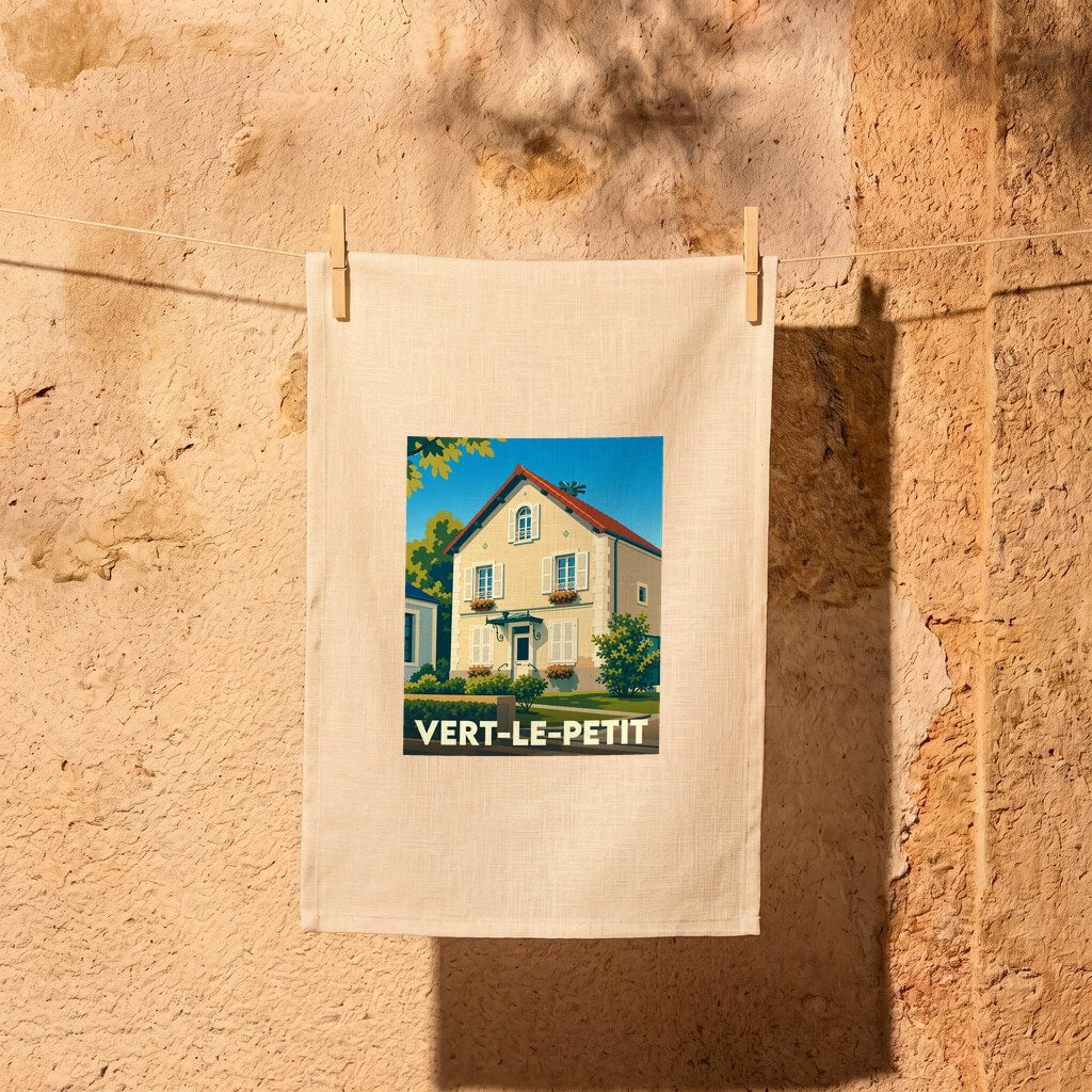 Torchon souvenir de la ville de Vert-le-Petit avec une illustration stylisée d'une maison traditionnelle.
