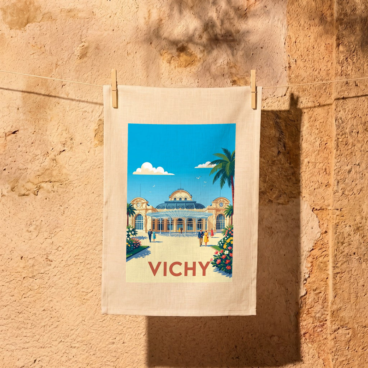 Torchon souvenir de la ville de Vichy avec une illustration colorée de style vintage.