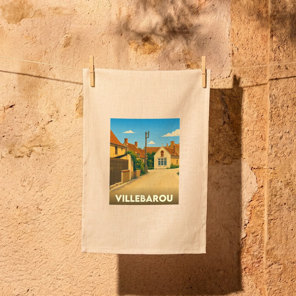 Torchon souvenir de la ville de Villebarou avec une illustration stylisée d'une rue ensoleillée.