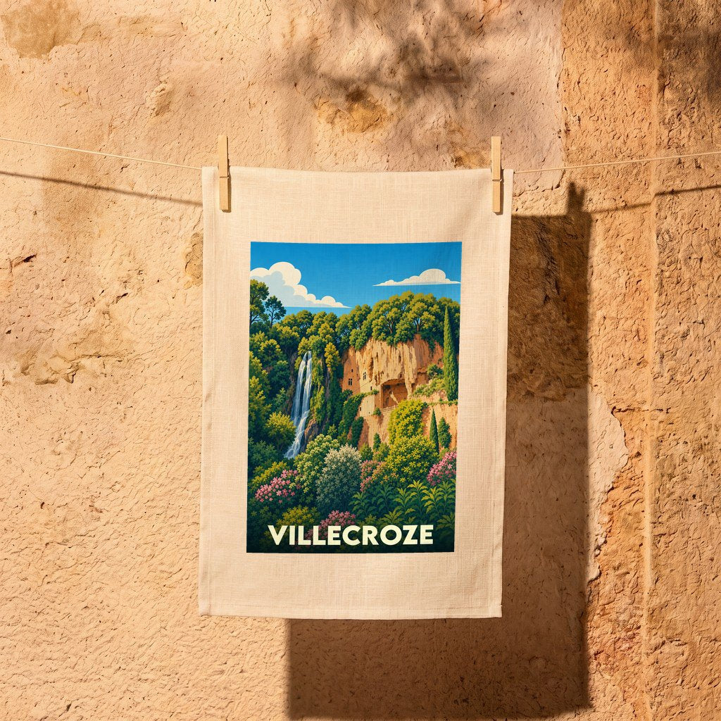 Torchon souvenir de la ville de Villecroze illustré d'une scène de cascade et de grottes troglodytiques.