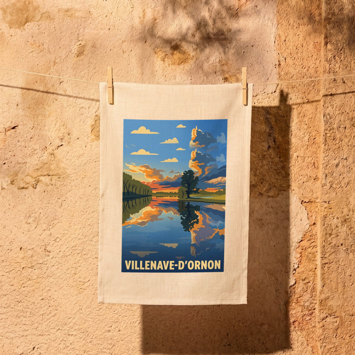 Torchon souvenir de la ville de Villenave-d'Ornon avec une illustration de paysage stylisée.