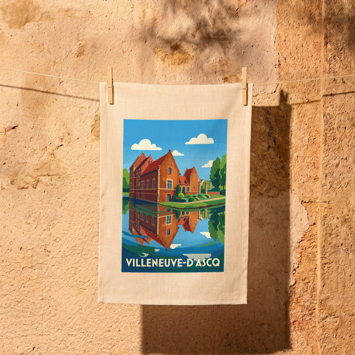 Torchon souvenir de la ville de Villeneuve-d'Ascq avec une illustration stylisée.
