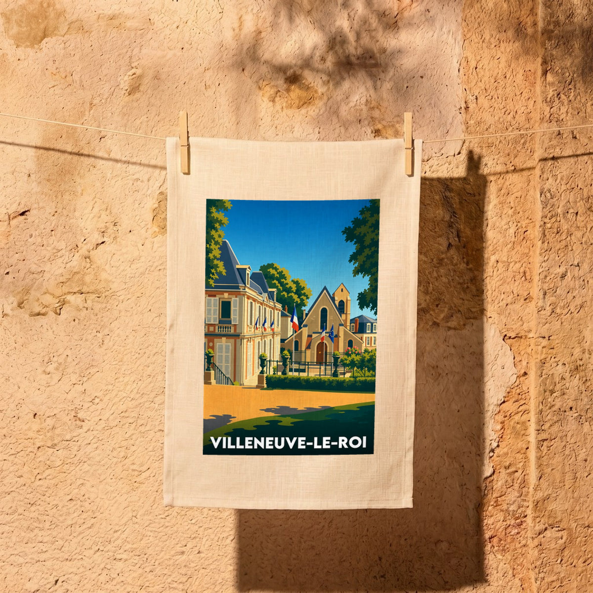 Torchon souvenir de la ville de Villeneuve-le-Roi avec une illustration stylisée.