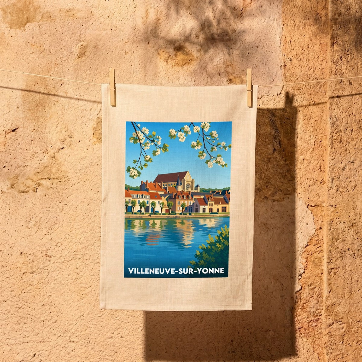 Torchon souvenir de la ville de Villeneuve-sur-Yonne avec une illustration stylisée.